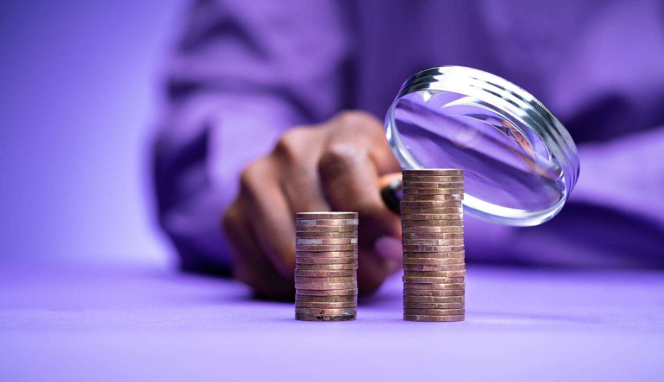 Money and a magnifying glass
